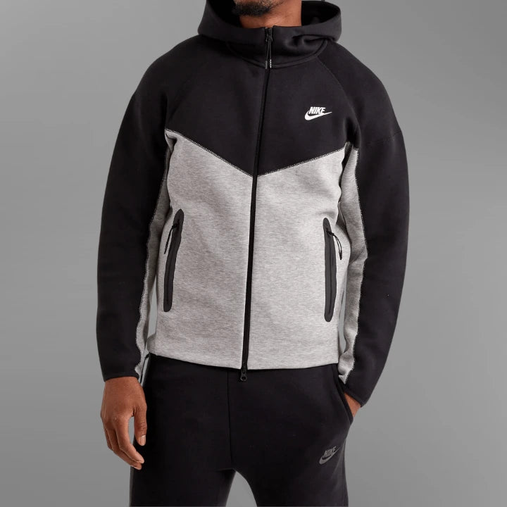 Black and gray Nike hoodie on a gray background