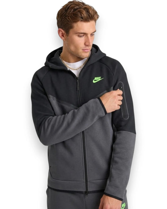 Man wearing a gray Nike hoodie on a white background